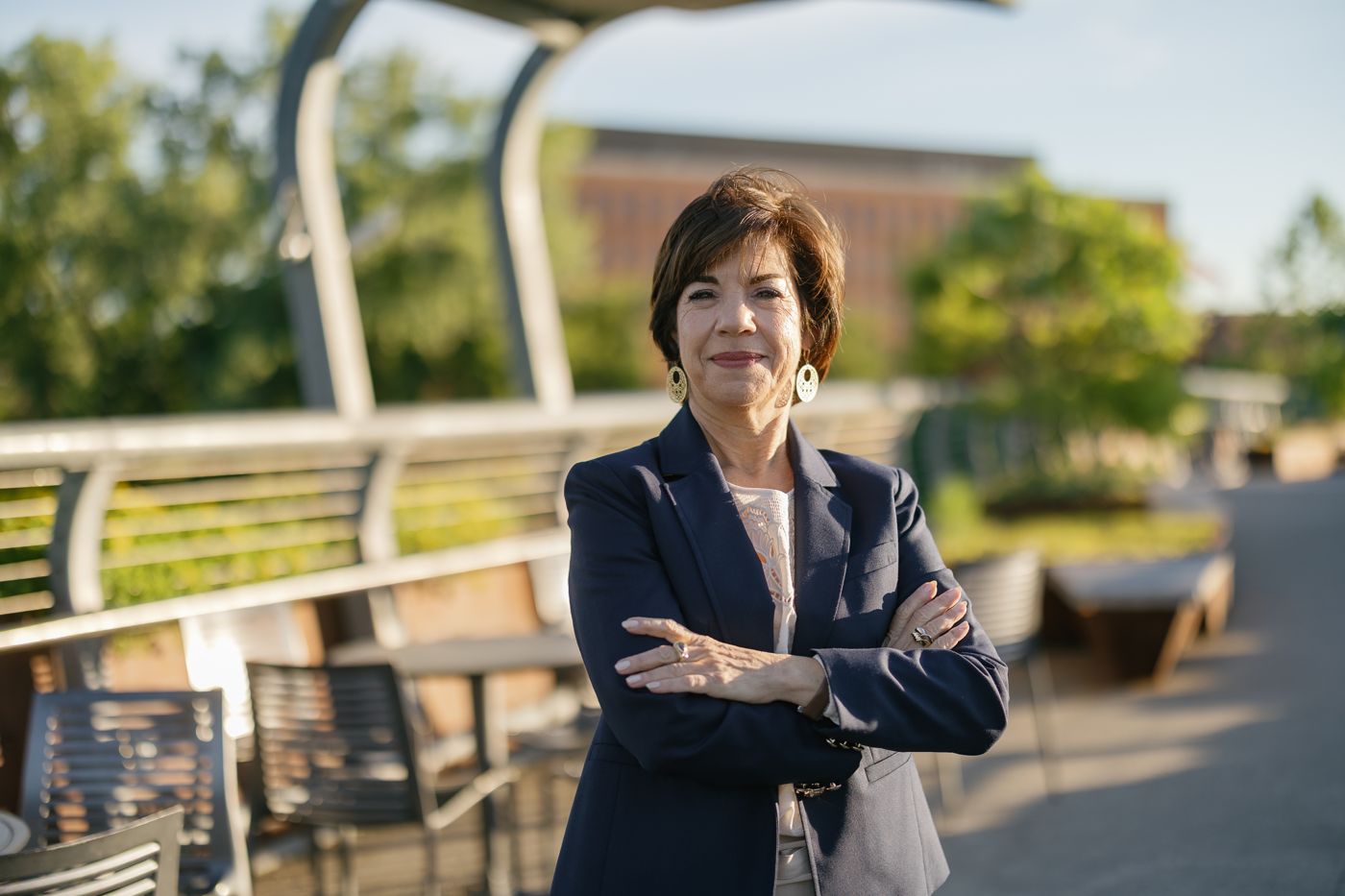 Sharon Kolb, arms crossed, smiling